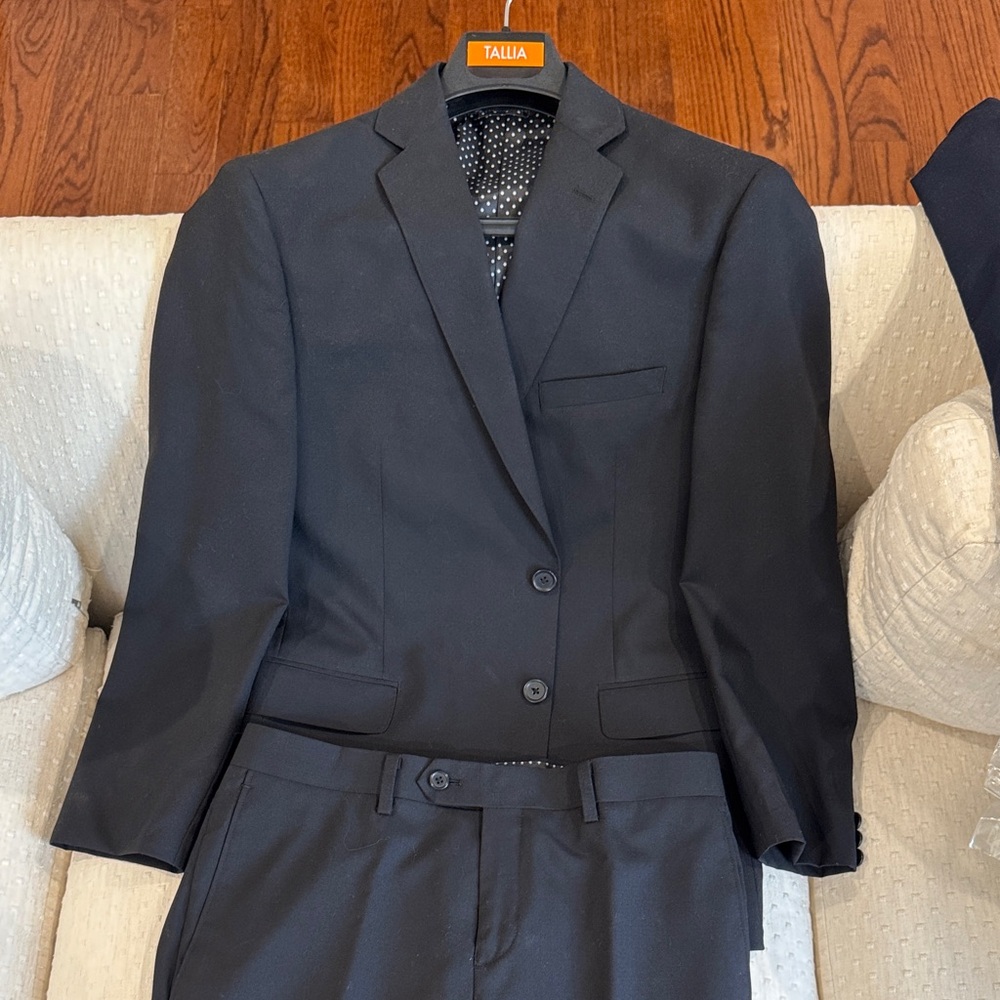 TALLIA Boys Black Suit with Polka Dot Lining.